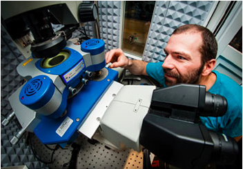 	Dr Nic Mullin adjusts a sample on the JPK NanoWizard® 3 AFM system at the University of Sheffield