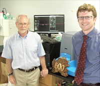 Drs Mark Davis & Devin Wiley of Caltech accept a plaque in recognition of their recent paper being the 800th citing NTA