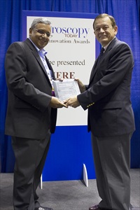 Mohan Ananth from ZEISS accepting the Microscopy Today Innovation Award for ORION NanoFab at M&M in Indianapolis USA